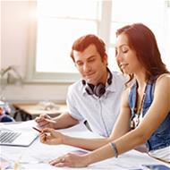 Young couple looks over mortgage affordability