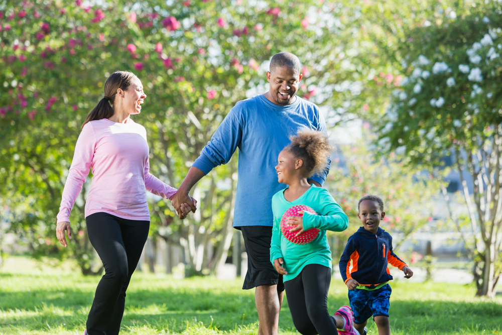 Parents playing with their children in a park