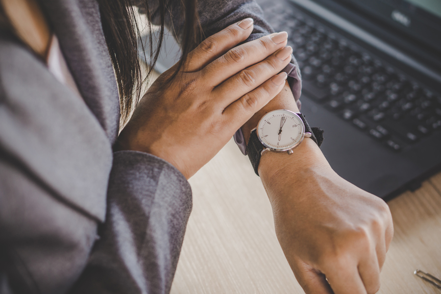 businesswoman checking her watch